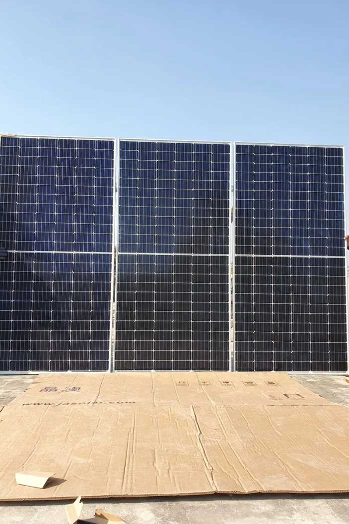Solar panels covering a vast warehouse roof