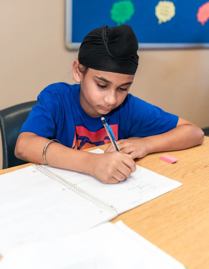 A student working through a problem with a tutor