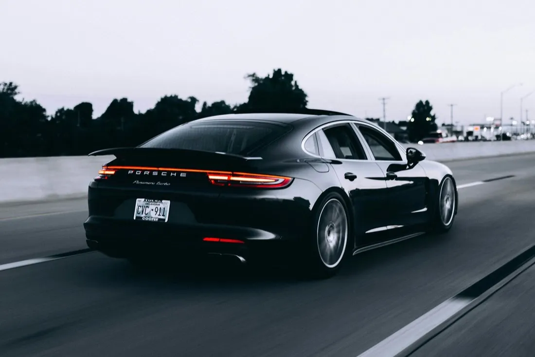 Detailed black sports car under studio light