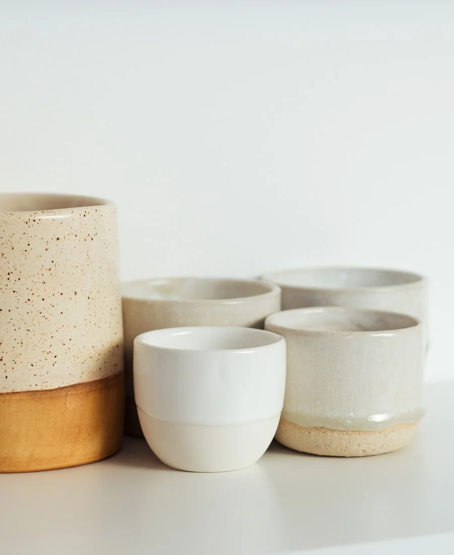 Pottery drying on studio shelf