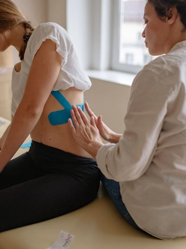 Chiropractor working with a spinal model